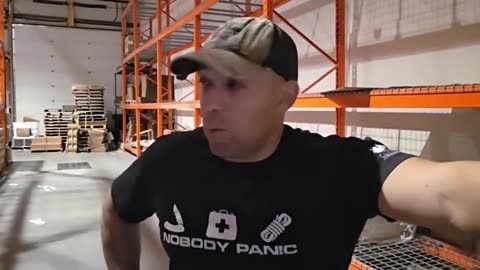 AN HIS SHIRT SAYS... NOBODY PANIC... WOULD YOU CALL THIS ORGANIZED FEAR MONGERING OR TRUE.