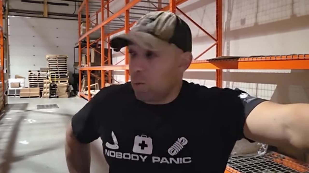 AN HIS SHIRT SAYS... NOBODY PANIC... WOULD YOU CALL THIS ORGANIZED FEAR MONGERING OR TRUE.