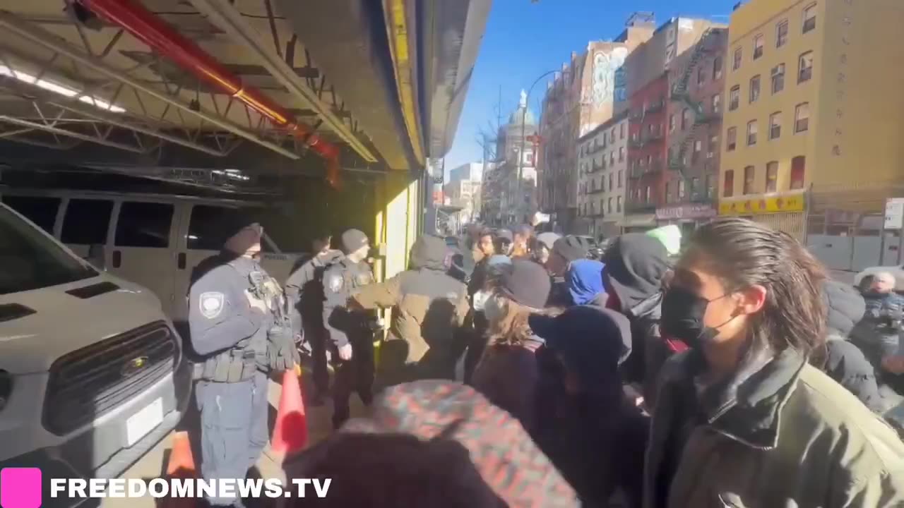 Activist block ICE agents in a garage as they are staging for operation