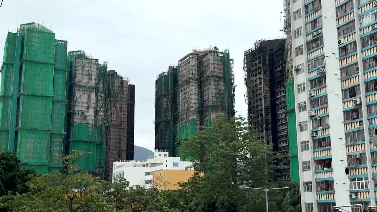 Hong Kong fire toll rises as Beijing warns against protests