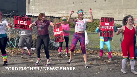Anti-ICE protesters hold a 80’s themed yoga class outside the Portland ICE facility.