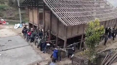 Chinese villagers help neighbor to move house