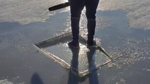 Ice Breaks Around Chainsaw