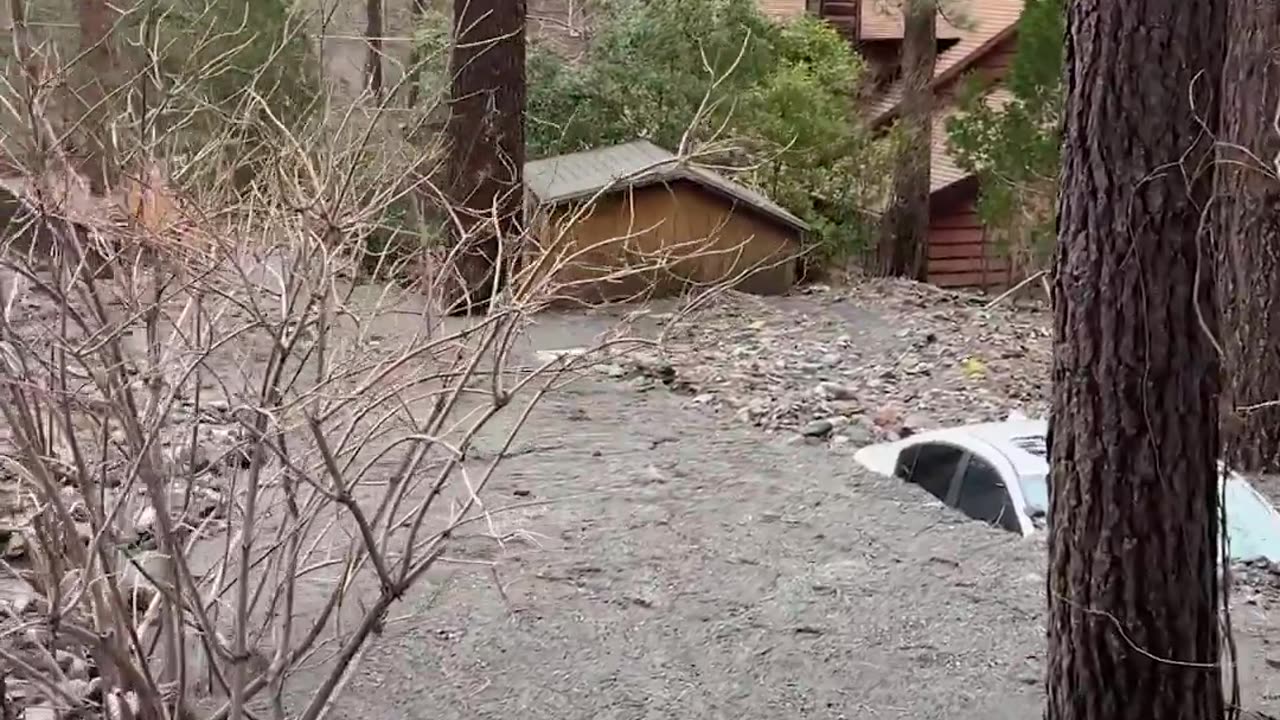 Emergency crews in California released video revealing homes and vehicles engulfed by mud and debris