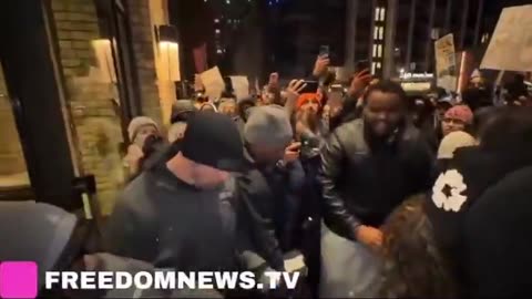 Anti-ICE protester SPITS at the face of a hotel security guard in Minneapolis