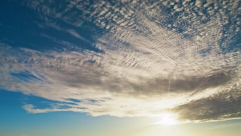 Sky view with sun and clouds in a timelapse