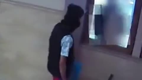 Migrant is seen on CCTV released by Dutch Politie lighting a fire on a train and at the station