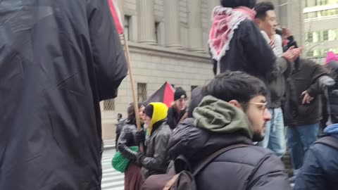 People in NYC demand “ARMS EMBARGO NOW!” before the New Year.