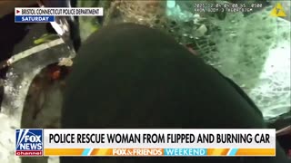 Connecticut police rescue a woman from a burning car that had flipped over.