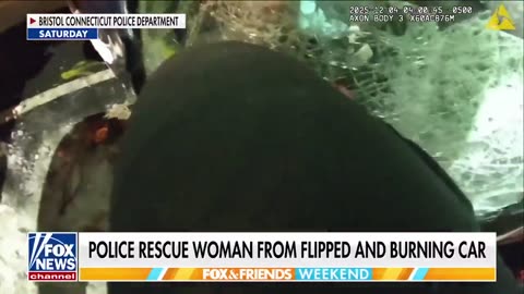 Connecticut police rescue a woman from a burning car that had flipped over.