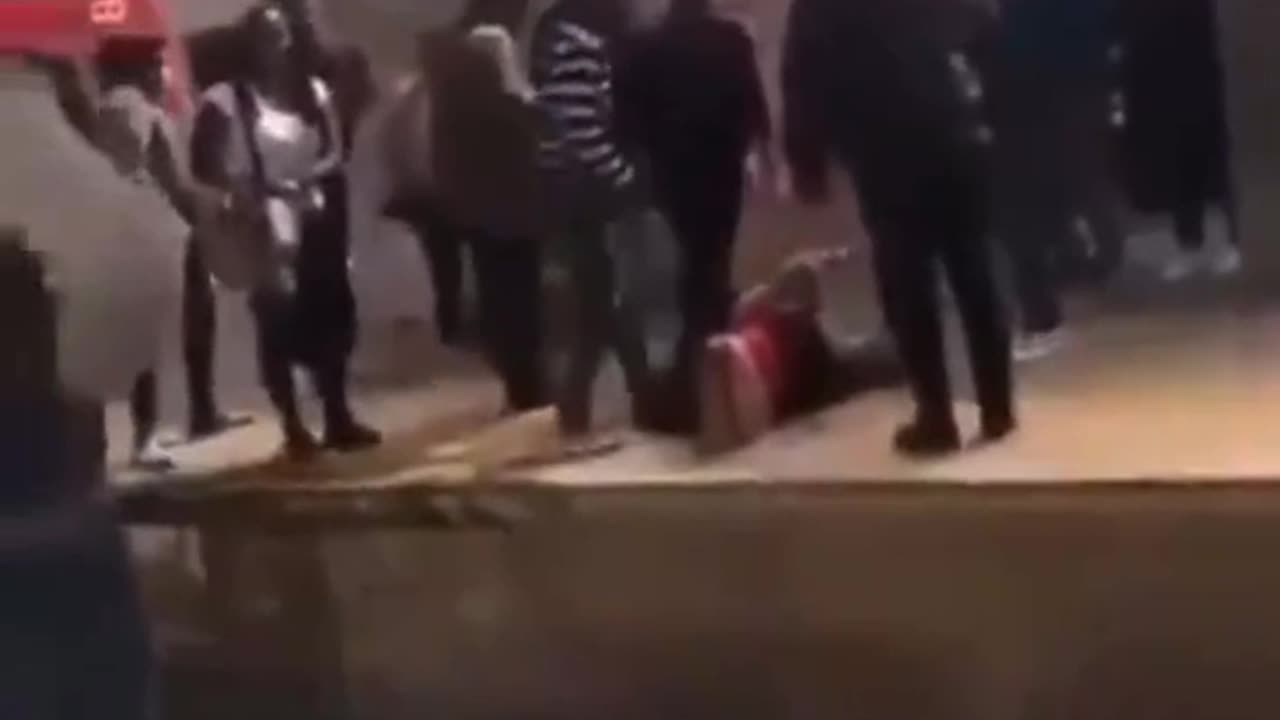 Blonde hair white woman slammed to the ground and humiliated by 10 africans as people watch