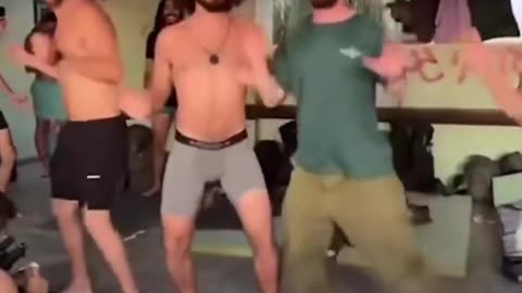 Israeli soldiers dance in a Gaza City school after evicting families that sheltered there