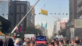 At a march in Tehran: Trump and Bibi dolls hang on a rope