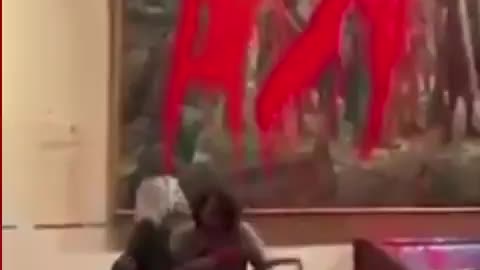 Activists have just thrown red paint on a painting of Christopher Columbus at Madrid’s Museum