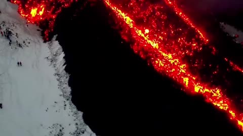 Snowboarding Next to Flowing Lava