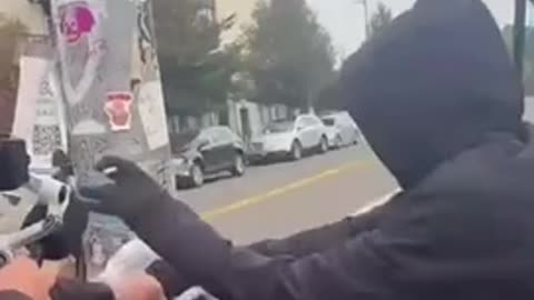 Antifa member FREAKS OUT when he discovers someone has put up a poster with Antifa names and faces