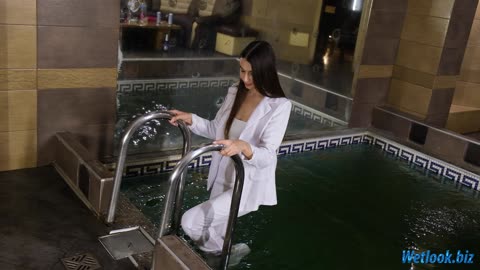 Wetlook girl in white suit