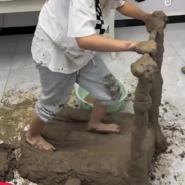 Kid building a treadmill from mud.hd