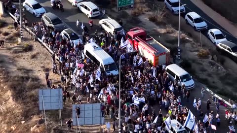 Freed hostage greeted by cheering crowd on return home to West Bank