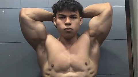 20 years old bodybuilder flexing muscles