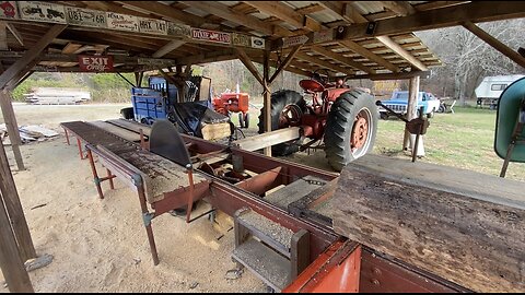 Running a sawmill in East Tennessee with a Super M Farmall