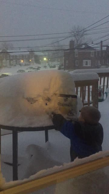 Little Boy Grabs Beer for His Dad in the Snow