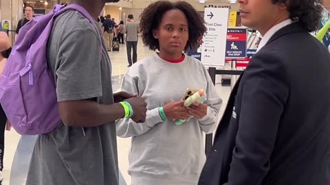 A Haitian family unit at the airport looking for the nearest ASPCA pet store.