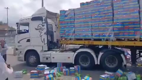 Israeli settlers laugh as they destroy humanitarian aid for Gaza