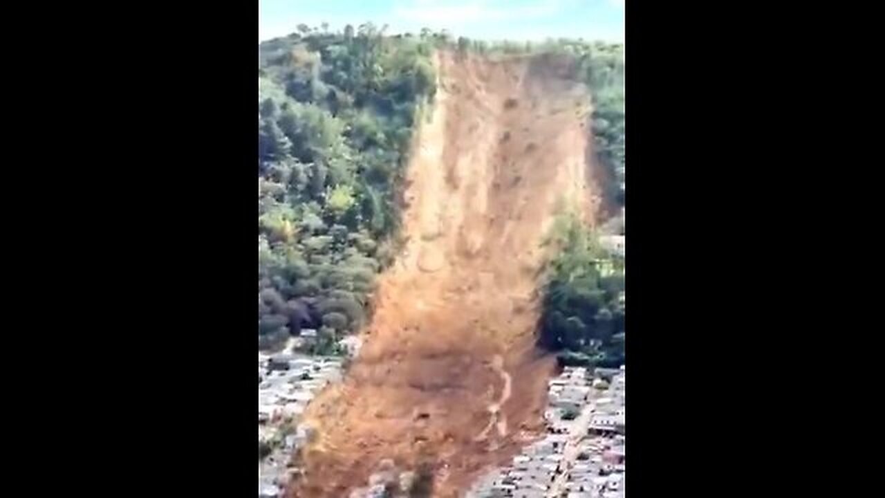 A landslide in India destroys a parking with cars