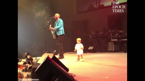 Quick Smile: baby ran out on stage with his dad. He started dancing and stole the show