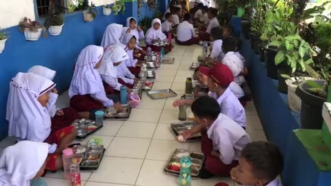 Joyful Lunchtime at School: Sharing Meals and Smiles