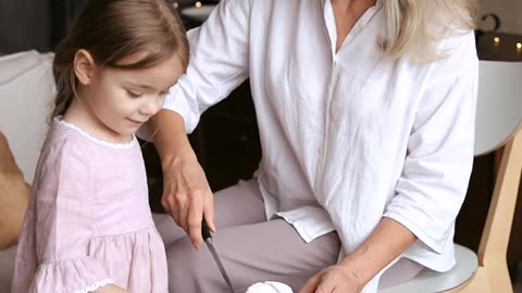 Mom and Daughter Tasting Cake