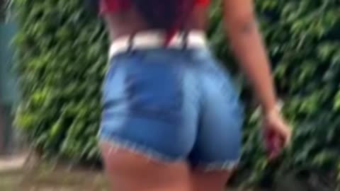 "Orange top with denim shorts trending summer vibes 🔥"