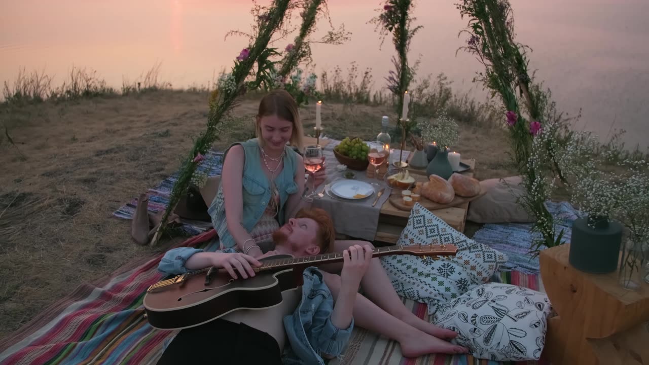 A Man Playing Guitar On A Date