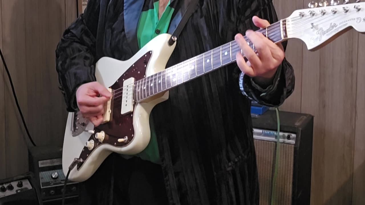 Country with a jazzmaster guitar.