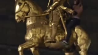 This is statue of Joan Arc in Paris, a symbol of French patriotism