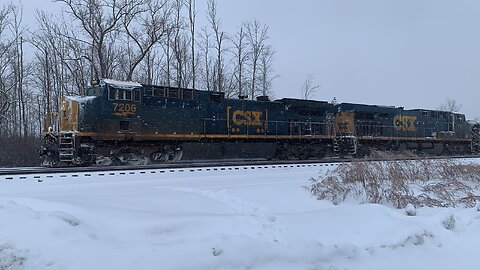 CSX Train 7206 and 715 lead the charge through the snow