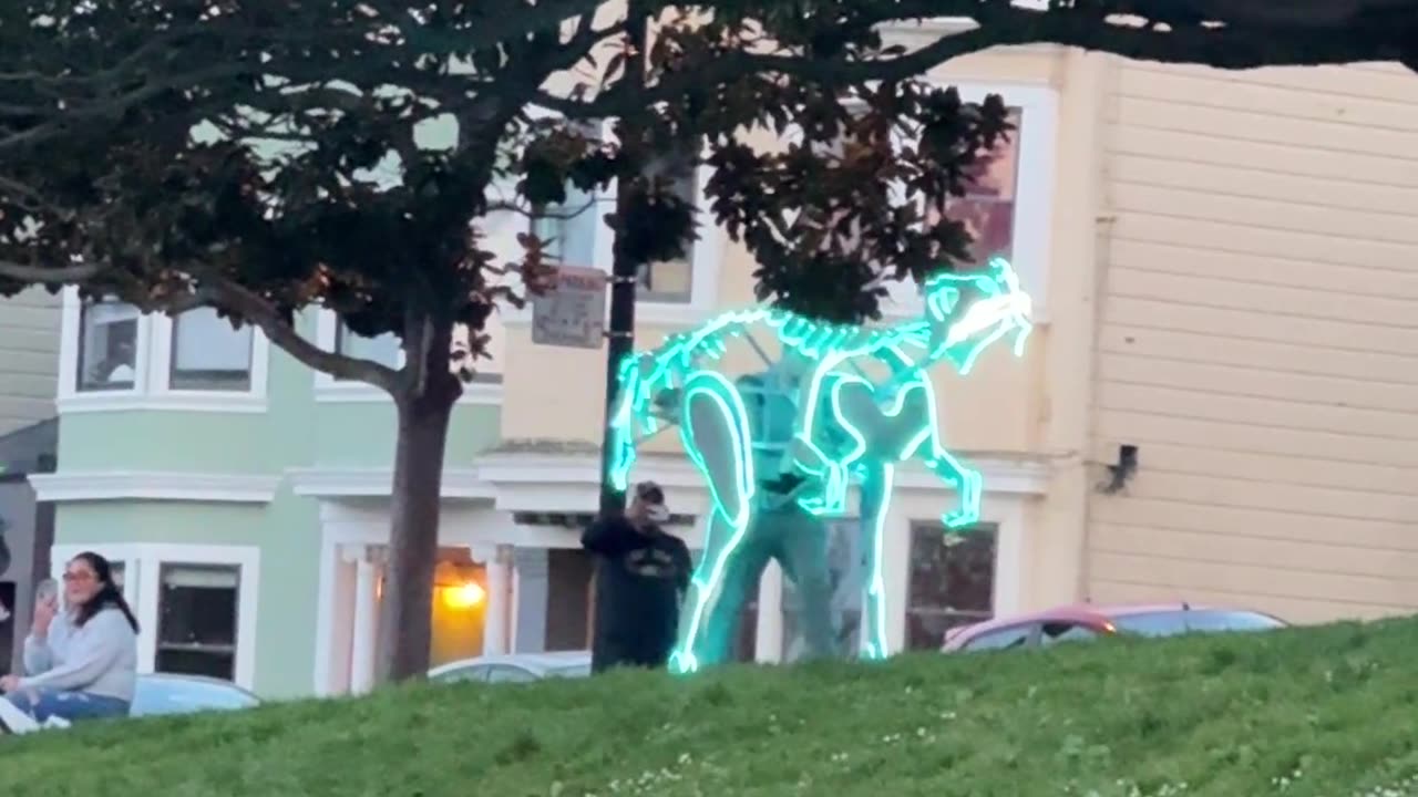Neon Blue Dinosaur Dances In Park