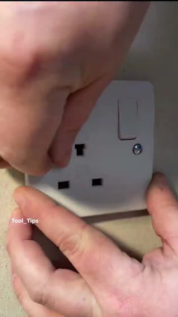 Close-up of Hand Cutting Drywall with Utility Knife