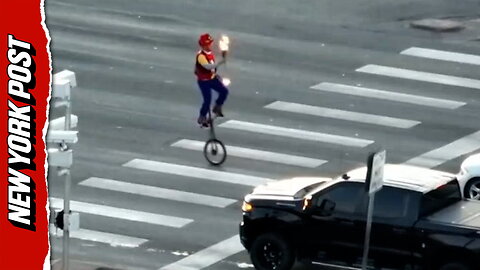 Fire-juggling unicyclist turns Colorado intersection into impromptu street show