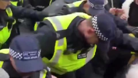 ANTIFA riot in London as police allow themselves to be pushed around.