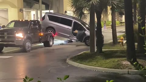 Squealing Van Escapes Tow Truck