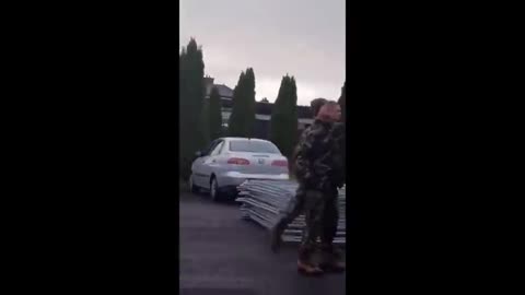 Irish woman confronts soldiers, who are under orders to help set up migrant camps