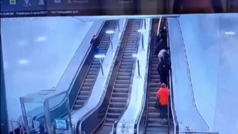 The long pole damaged the ceiling above the escalator.