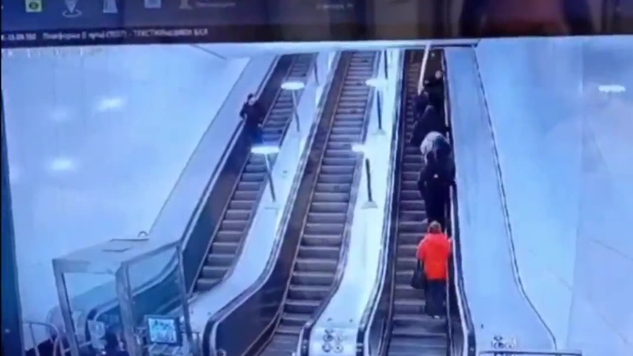 The long pole damaged the ceiling above the escalator.