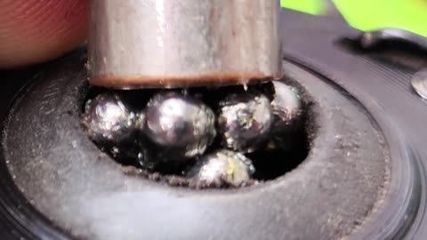 How to remove lumps from a bicycle wheel hub bearing.