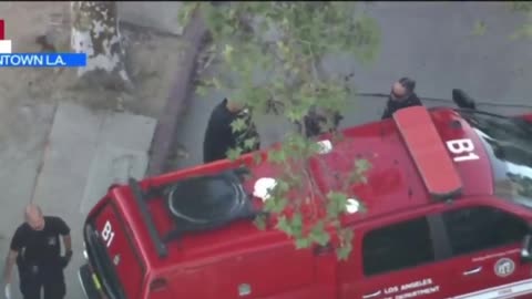 LA city hall barricaded man SURRENDERS to crisis negotiators hands on head