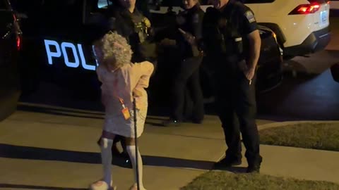 Young Grandma Poses With Police On Halloween