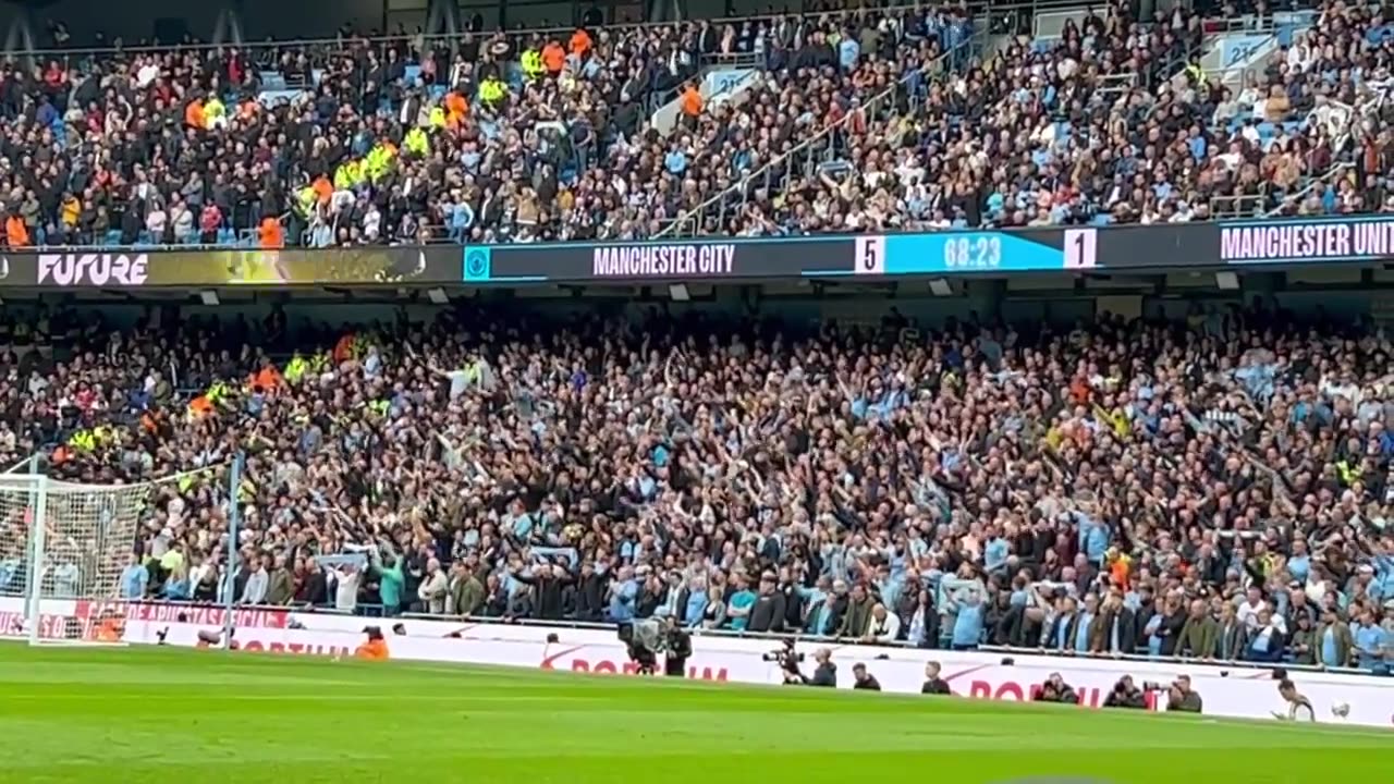 Manchester City fans teasing Manchester United fans _