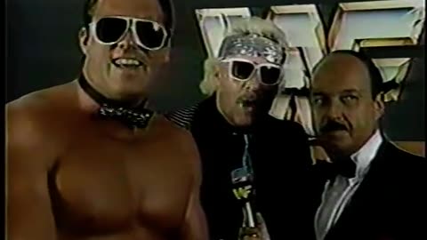 Brutus Beefcake in rhinestone bowtie & gloves laughing & loving it & Johnny V-Interview-1985